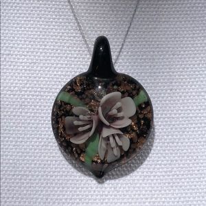 Purple flower with gold glass pendant